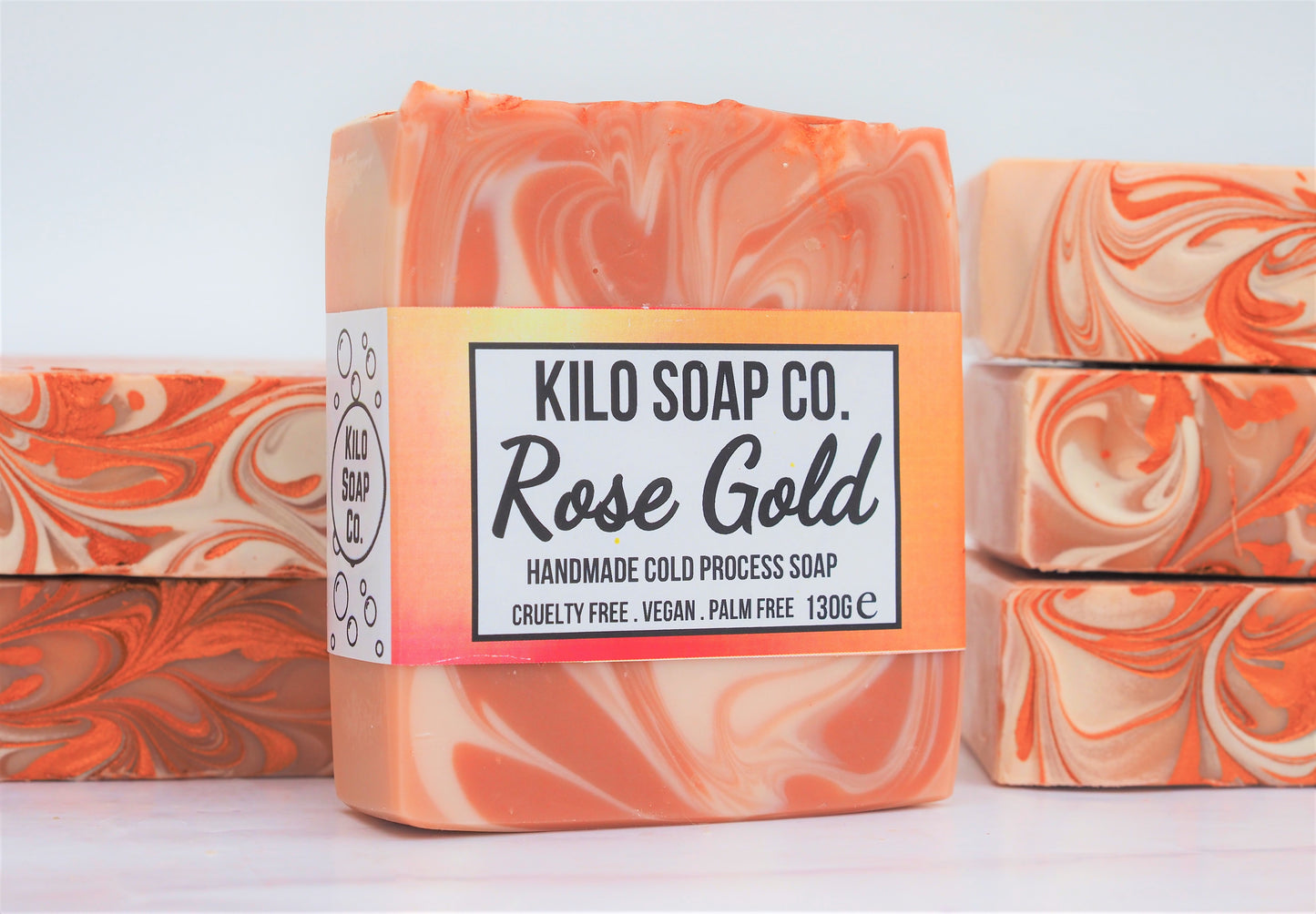 Elegant soap bar with rose and gold hues, scented with rose geranium and ylang-ylang. made in Spain with luxury skincare oils and butters.