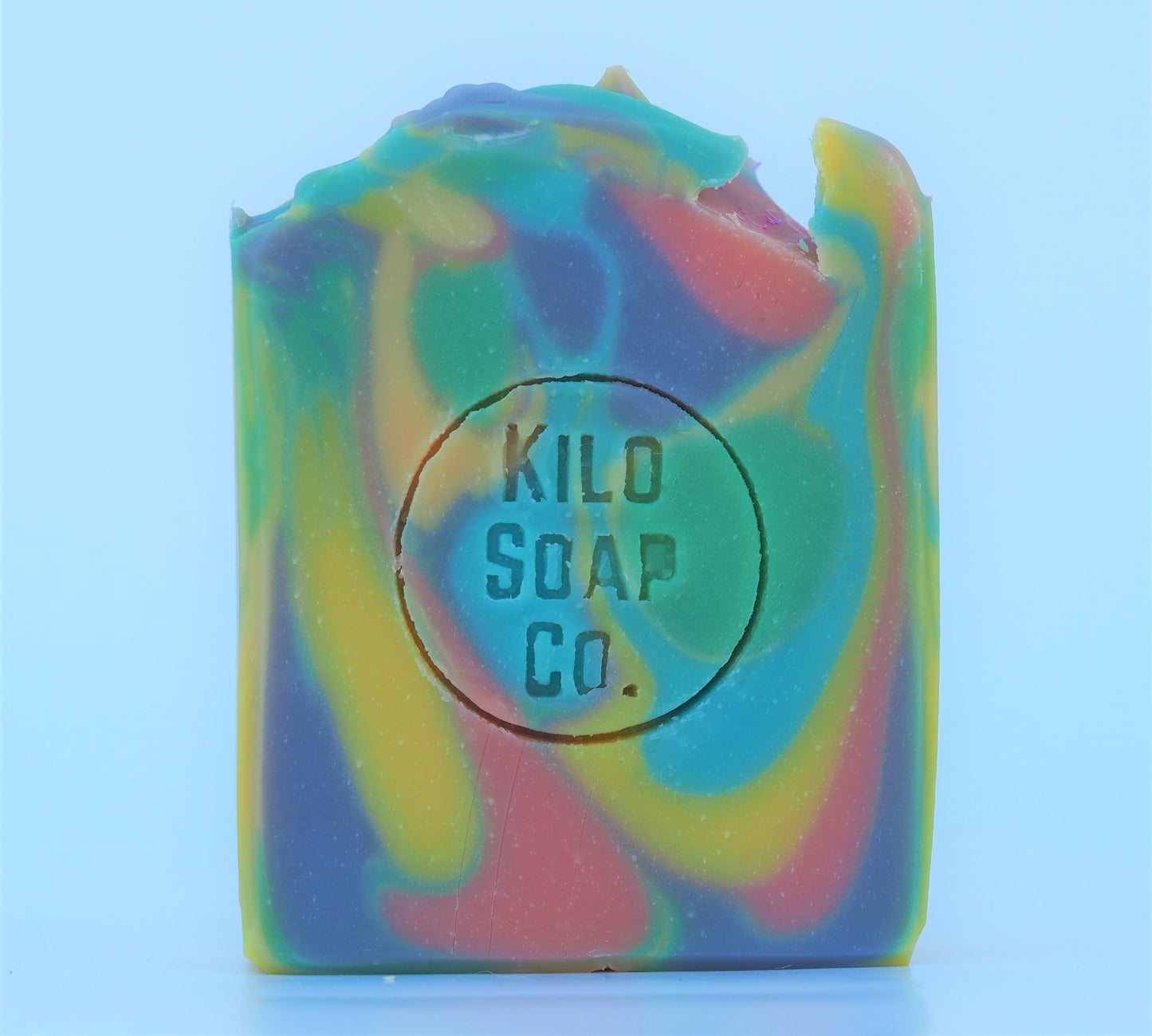 Psychedelic rainbow-colored soap bar with a patchouli and citrus scent. Luxury skincare made in Spain.