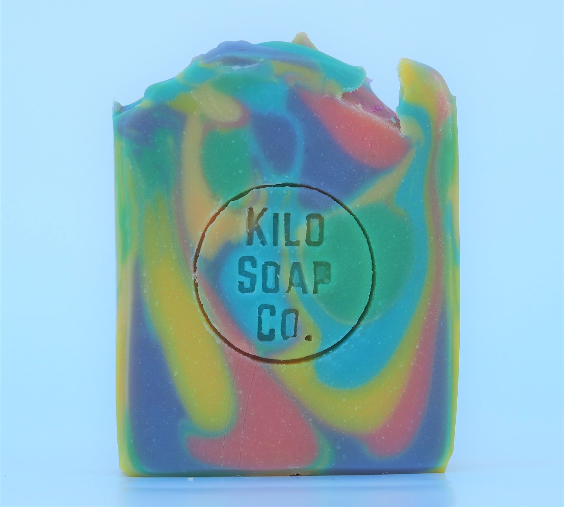 Psychedelic rainbow-colored soap bar with a patchouli and citrus scent. Luxury skincare made in Spain.