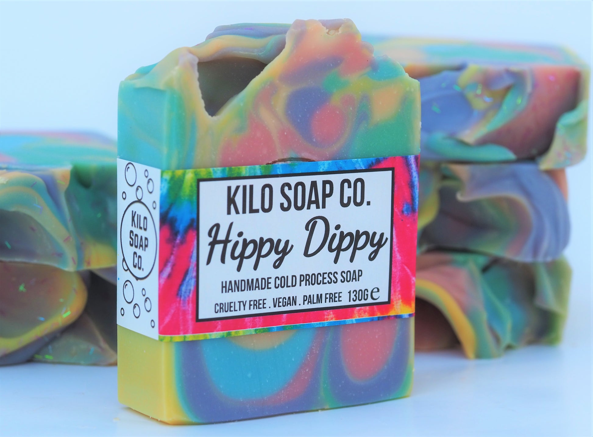 Psychedelic rainbow-colored soap bar with a patchouli and citrus scent. Luxury skincare made in Spain.
