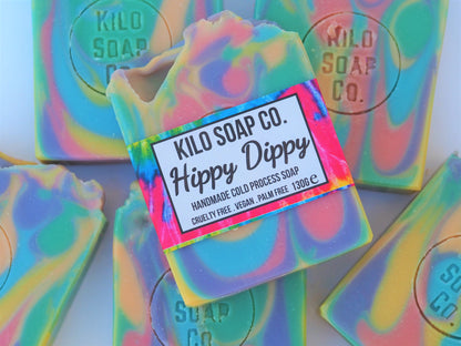 Psychedelic rainbow-colored soap bar with a patchouli and citrus scent. Luxury skincare made in Spain.